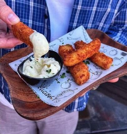 Golden halloumi fries dipped into homemade tzatziki